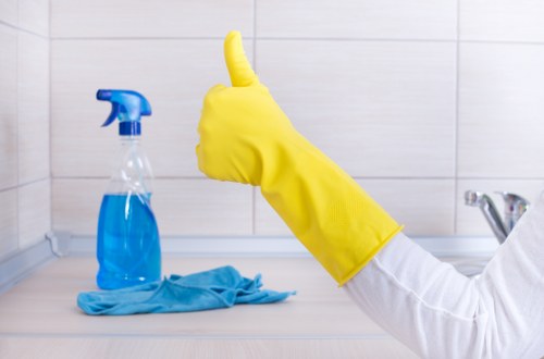 Deep cleaning team in Balham sanitising kitchen surfaces and fixtures